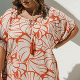 Close-up of handmade Pomegranate cotton tassels on V neckline