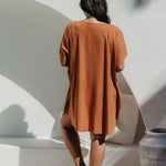 Back view of the Mocha Mousse short kaftan dress on a size S/M model, showing relaxed fit and just above-knee length