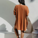 Back view of the Mocha Mousse short kaftan dress on a size S/M model, showing relaxed fit and just above-knee length