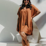 Front view of the Mocha Mousse short kaftan dress highlighting the kimono sleeves and elegant drape