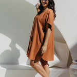 Side view of the Mocha Mousse short kaftan dress on a size S/M model, showing kimono sleeve drape and fluid silhouette