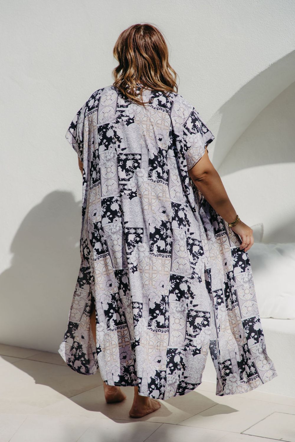 Back view of long patchwork kimono showing high side split and flowing fabric