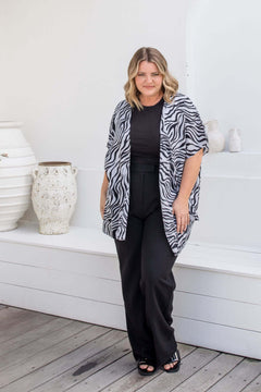 Front view of black and grey zebra print kimono cape with relaxed open drape