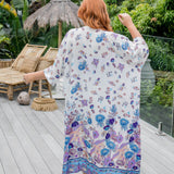 Back view of blue floral maxi kimono jacket showing full-length drape